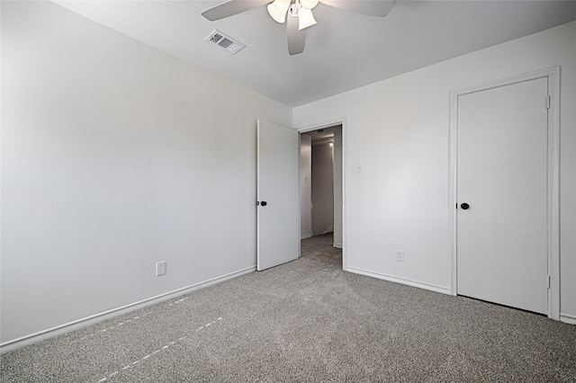 unfurnished bedroom with ceiling fan and carpet floors