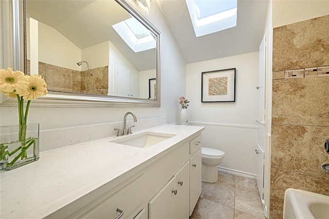 full bathroom with lofted ceiling, vanity, toilet, and tiled shower / bath