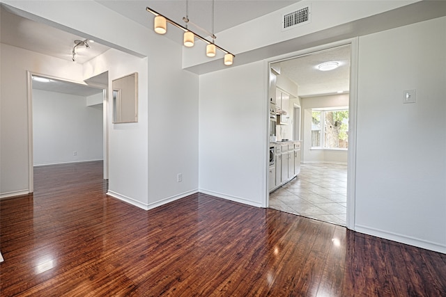 spare room featuring light hardwood / wood-style floors