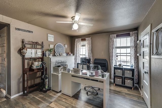 office space featuring ceiling fan, a textured ceiling, and hardwood / wood-style floors