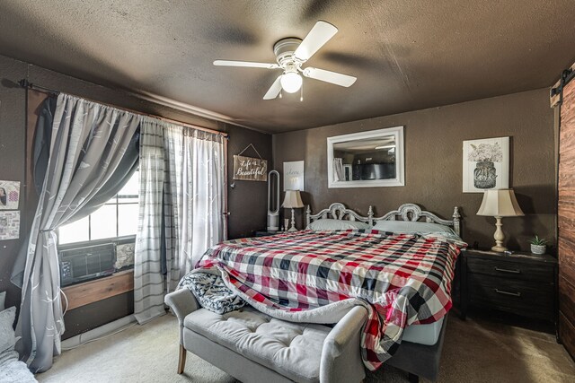 carpeted bedroom featuring a textured ceiling, a textured wall, and ceiling fan