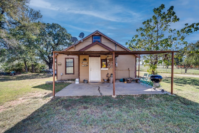 bungalow-style house featuring a patio and a front yard