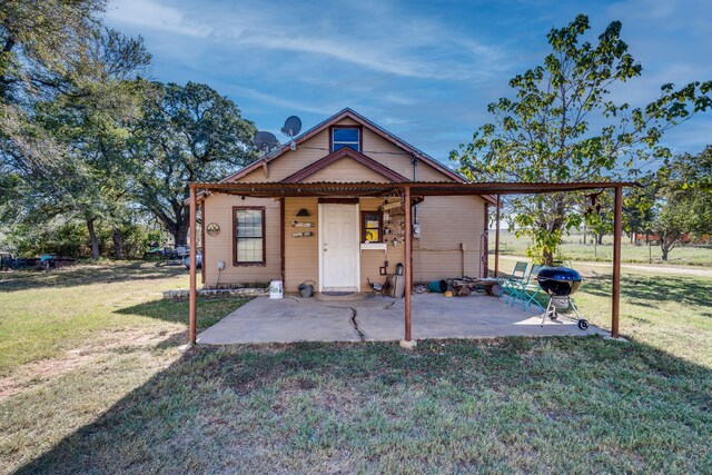 exterior space with a patio and a front yard