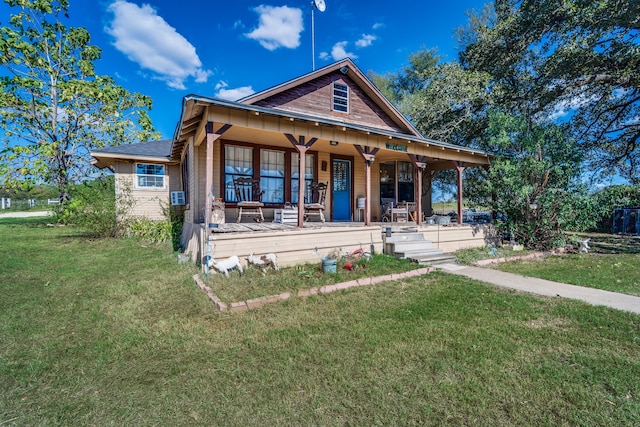 view of front facade with a porch and a front lawn