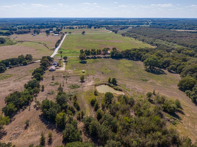 birds eye view of property with a rural view