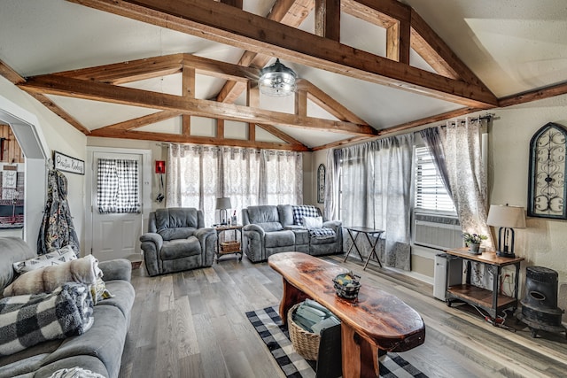 living room featuring light wood-type flooring, vaulted ceiling with beams, and cooling unit