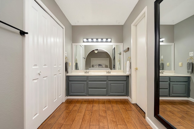 bathroom with vanity and hardwood / wood-style floors