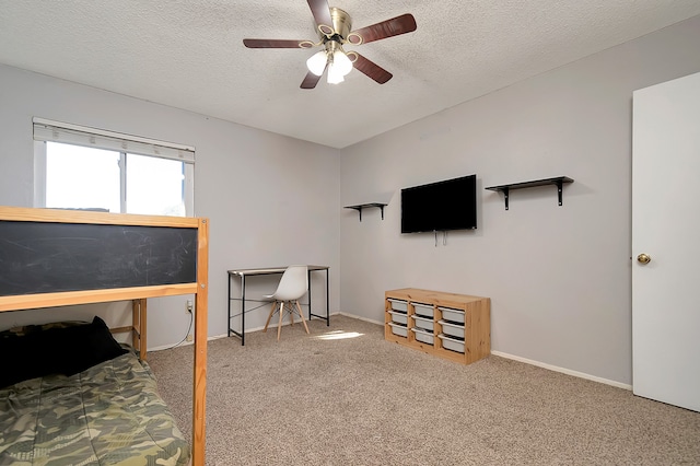 bedroom featuring carpet, ceiling fan, and a textured ceiling