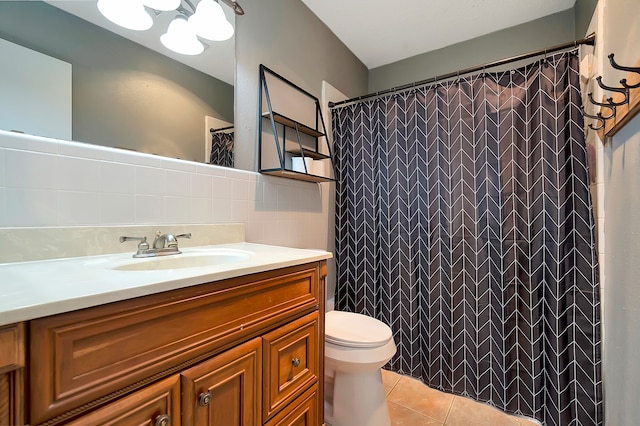 bathroom featuring tile walls, tile patterned flooring, backsplash, vanity, and toilet