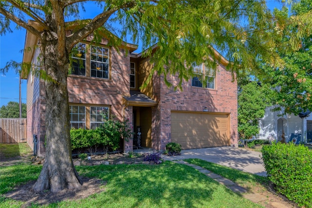 view of front of property with a front yard and a garage