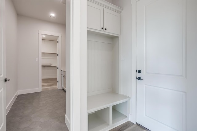 mudroom with dark wood-type flooring