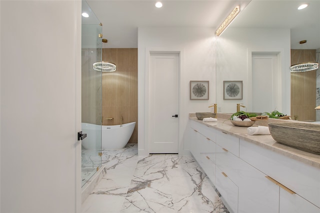 bathroom with vanity and separate shower and tub