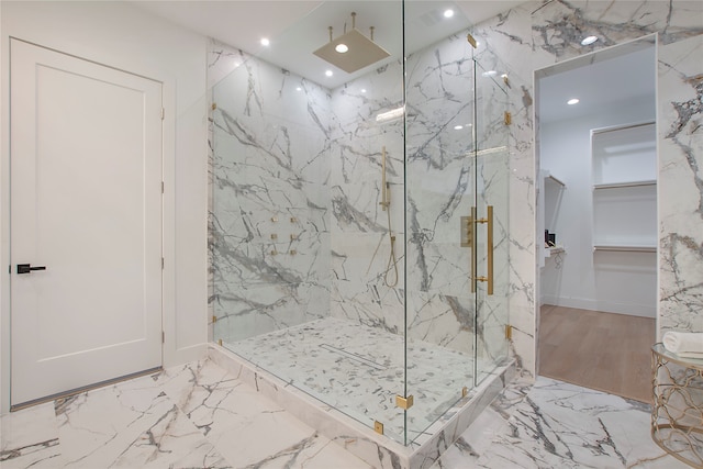 bathroom featuring wood-type flooring and a shower with door