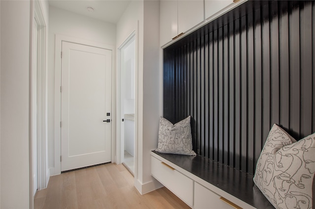 mudroom with light hardwood / wood-style floors