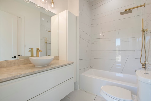 full bathroom with tiled shower / bath combo, vanity, and toilet