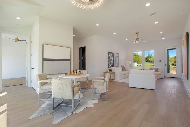 dining room with light wood-type flooring and ceiling fan