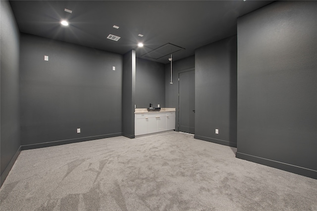 unfurnished room featuring light colored carpet