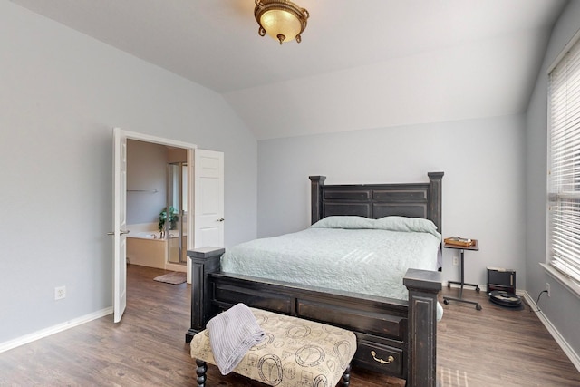 bedroom featuring vaulted ceiling and dark hardwood / wood-style flooring