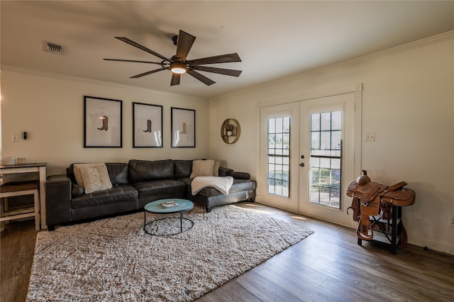 living room featuring ornamental molding, wood-type flooring, ceiling fan, and french doors