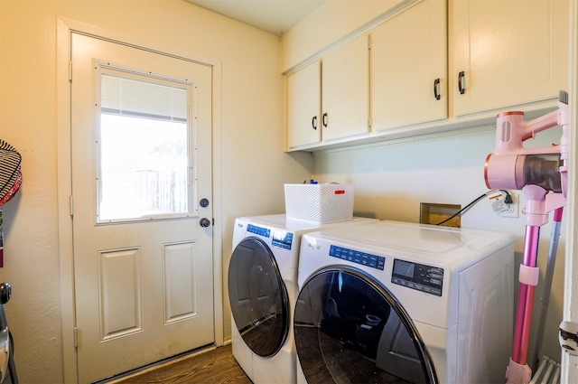 laundry area with cabinets, dark hardwood / wood-style floors, and independent washer and dryer