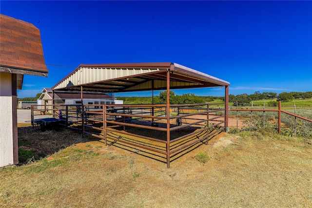 view of outdoor structure with a rural view