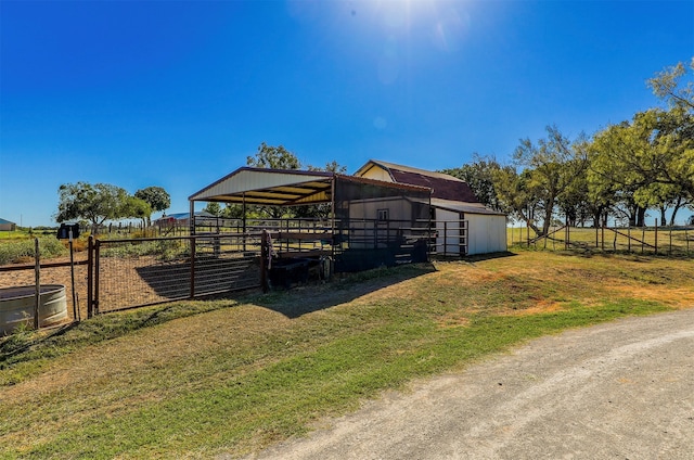 view of outbuilding with a rural view