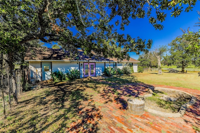 view of yard featuring french doors