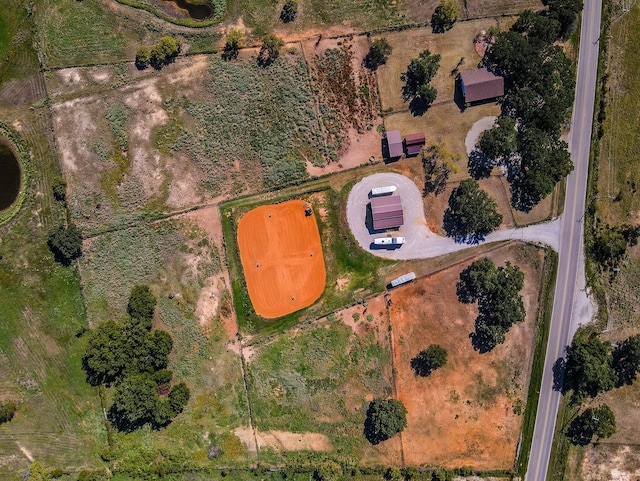 birds eye view of property featuring a rural view