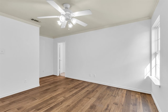 unfurnished room featuring ornamental molding, ceiling fan, and dark hardwood / wood-style flooring