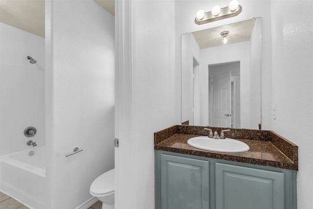 full bathroom with vanity, bathtub / shower combination, toilet, and tile patterned flooring