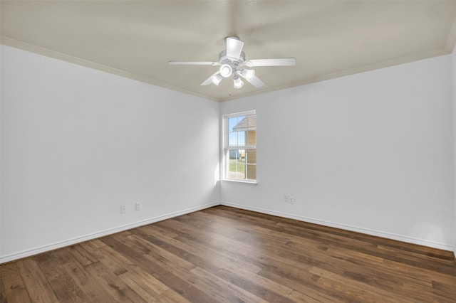 empty room with ornamental molding, ceiling fan, and dark hardwood / wood-style floors