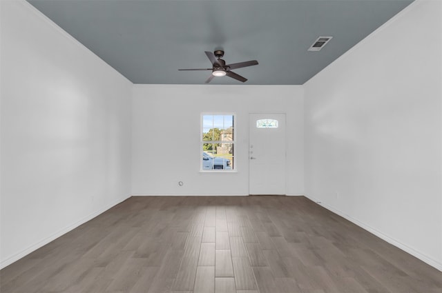 empty room featuring ceiling fan and wood-type flooring