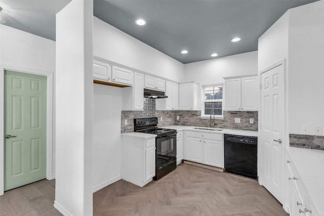 kitchen with black appliances, light parquet flooring, white cabinetry, and sink