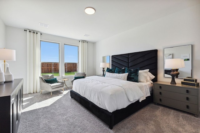 bedroom featuring dark colored carpet