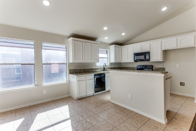 kitchen featuring white cabinets, light tile patterned floors, vaulted ceiling, and black appliances