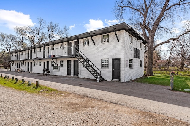 exterior space with cooling unit and a balcony