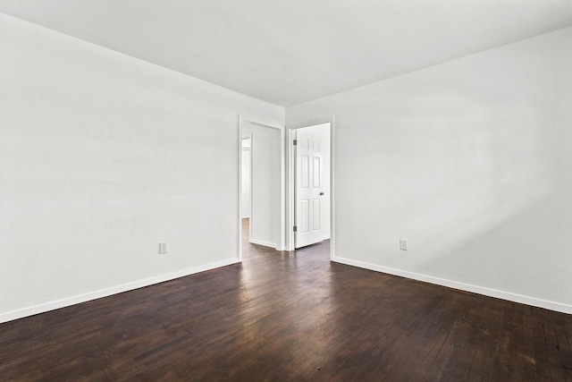 empty room featuring dark hardwood / wood-style floors