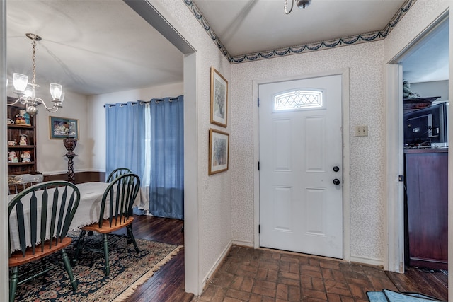 entryway featuring a chandelier