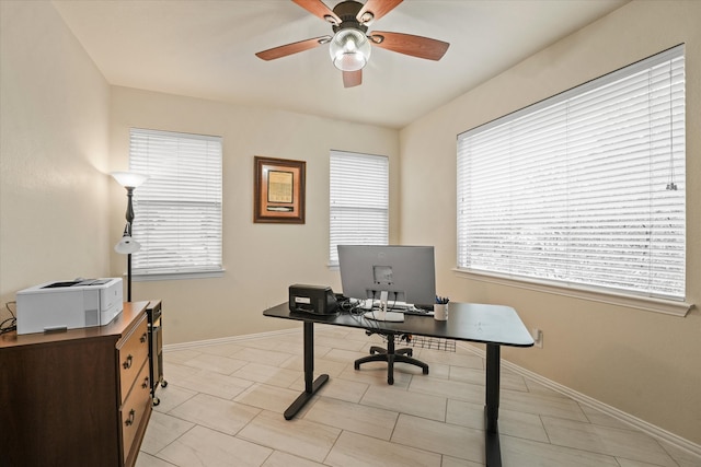 office area featuring a wealth of natural light and ceiling fan