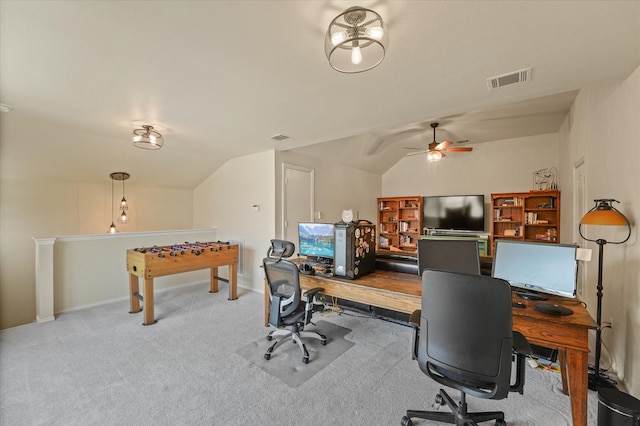 carpeted home office with vaulted ceiling and ceiling fan