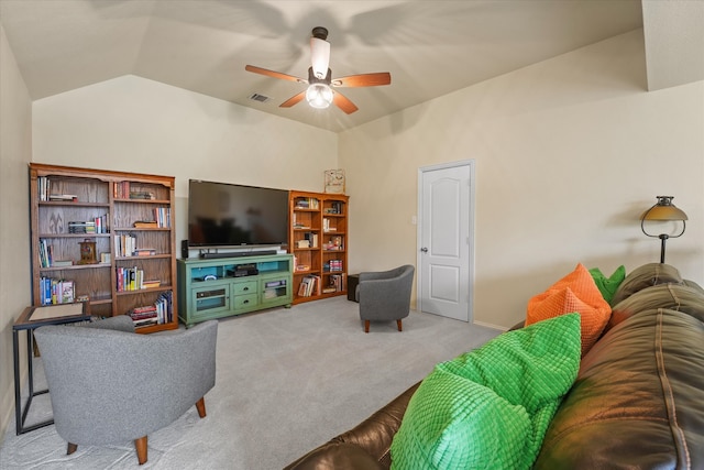 carpeted living room featuring ceiling fan and lofted ceiling