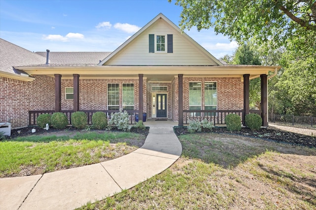 view of front facade with a porch and a front yard