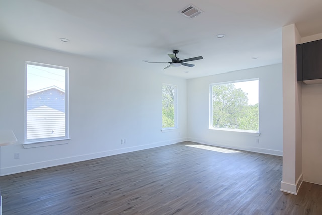 unfurnished room with ceiling fan and dark hardwood / wood-style floors