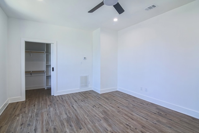 spare room with hardwood / wood-style flooring and ceiling fan