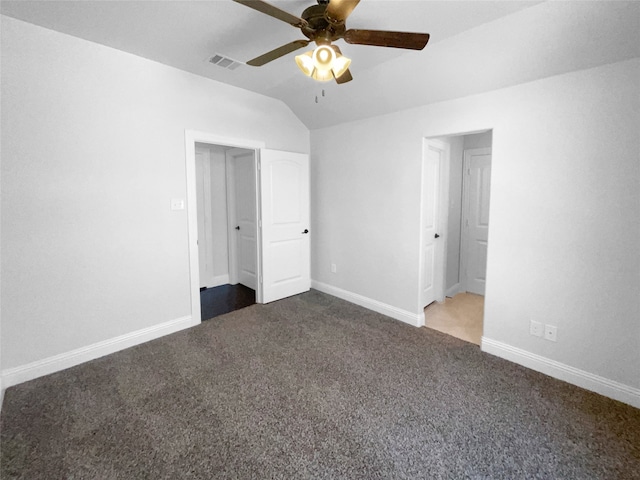 unfurnished bedroom featuring lofted ceiling, ceiling fan, and carpet flooring