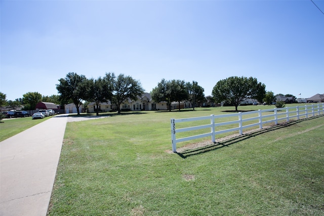 view of home's community with a lawn