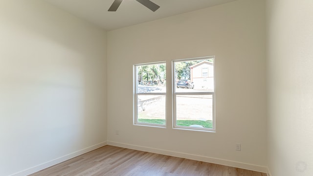 spare room with light hardwood / wood-style floors and ceiling fan