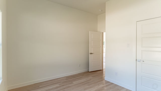 spare room with light hardwood / wood-style flooring