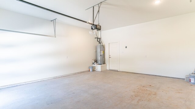 garage with a garage door opener and water heater