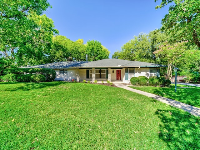 ranch-style house with a front lawn